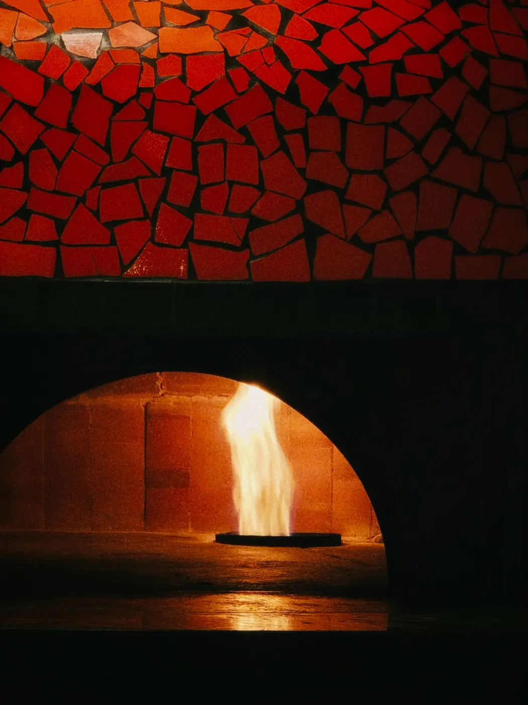 A well-maintained wood-fired oven finished in mosaic tile