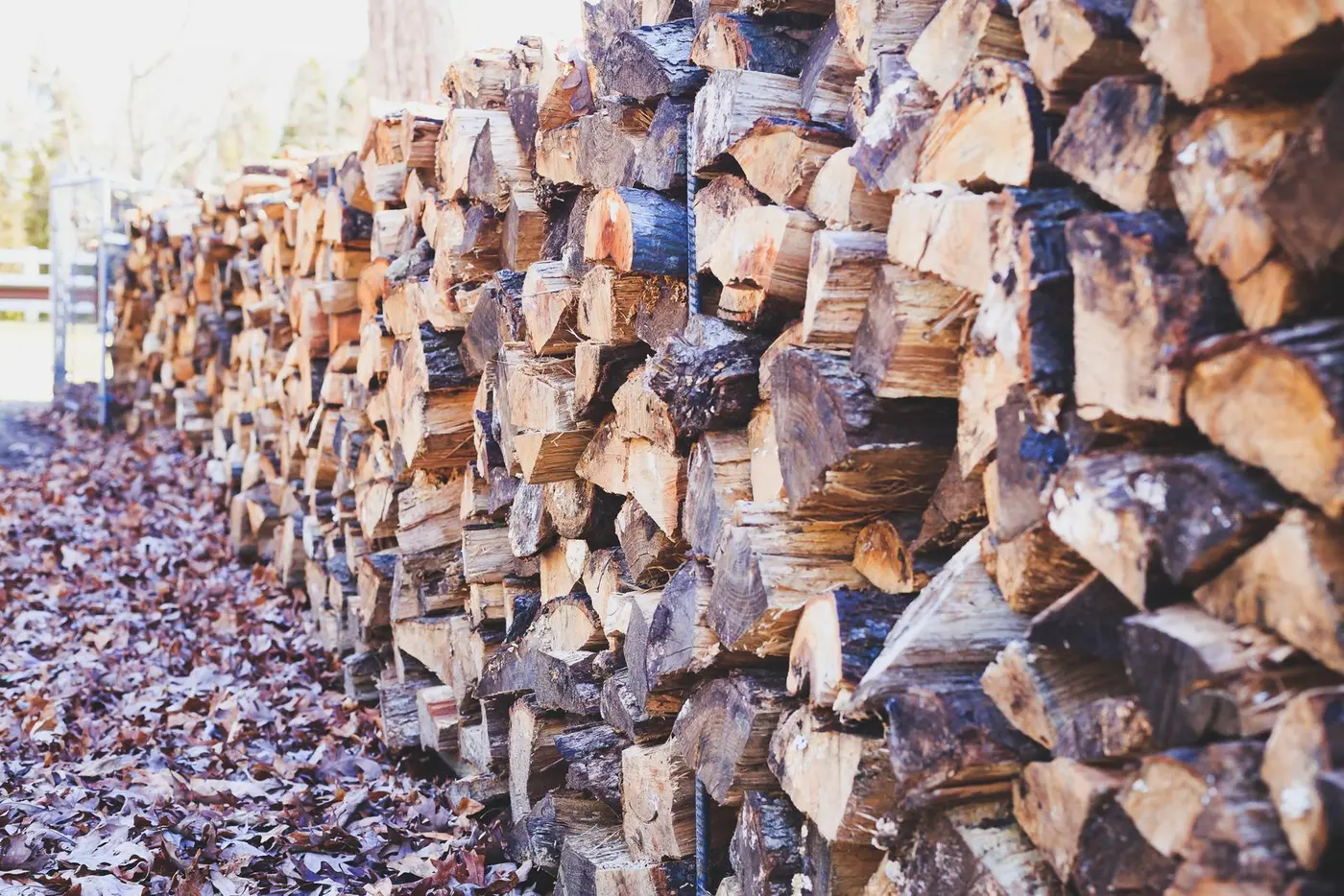 A stack of split, dry firewood logs seasoned for burning