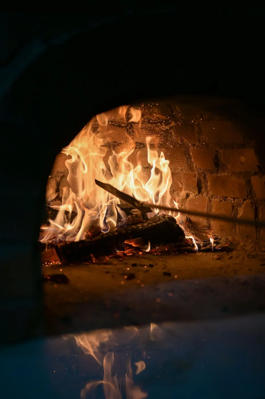 The hot interior of a brick oven glowing at working temperature
